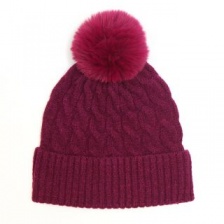 50% recycled magenta cable knit and faux fur bobble hat by Peace of Mind